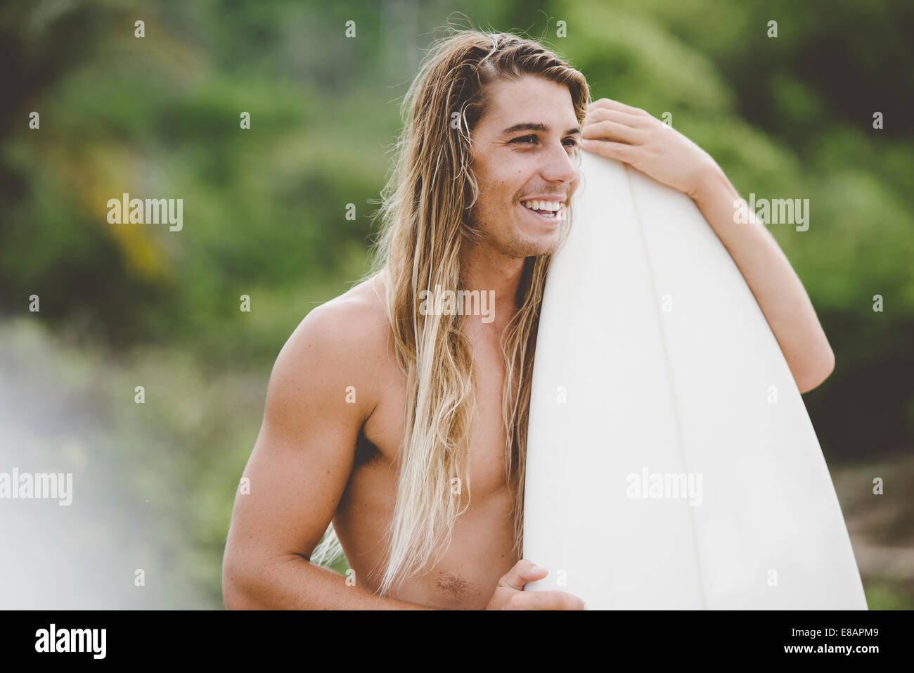 Australian surfer with surfboard, Bacocho, Puerto Escondido, Mexico Stock Photo