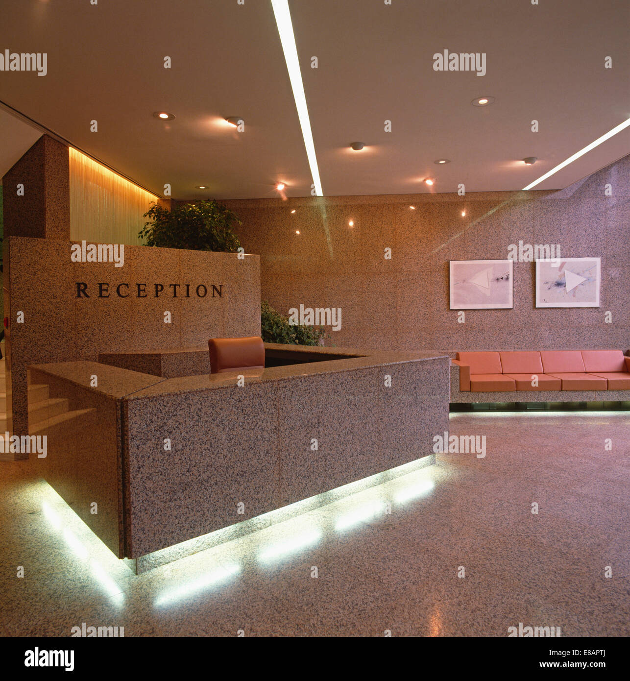 Under Lit Granite Desk In Reception Area Of City Office Stock