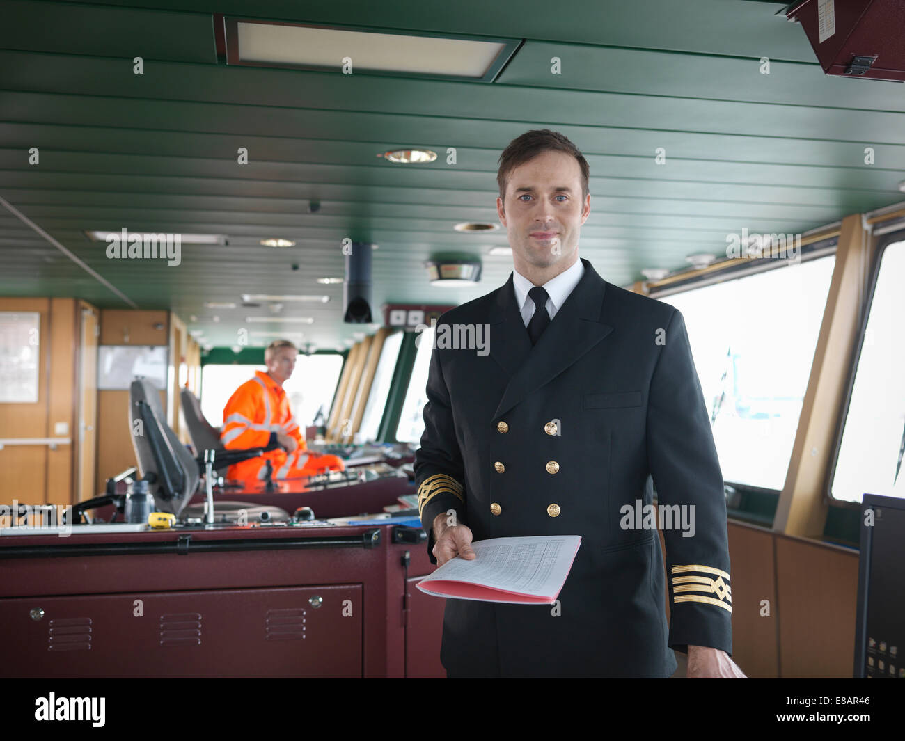 Portrait of captain on bridge of ship Stock Photo