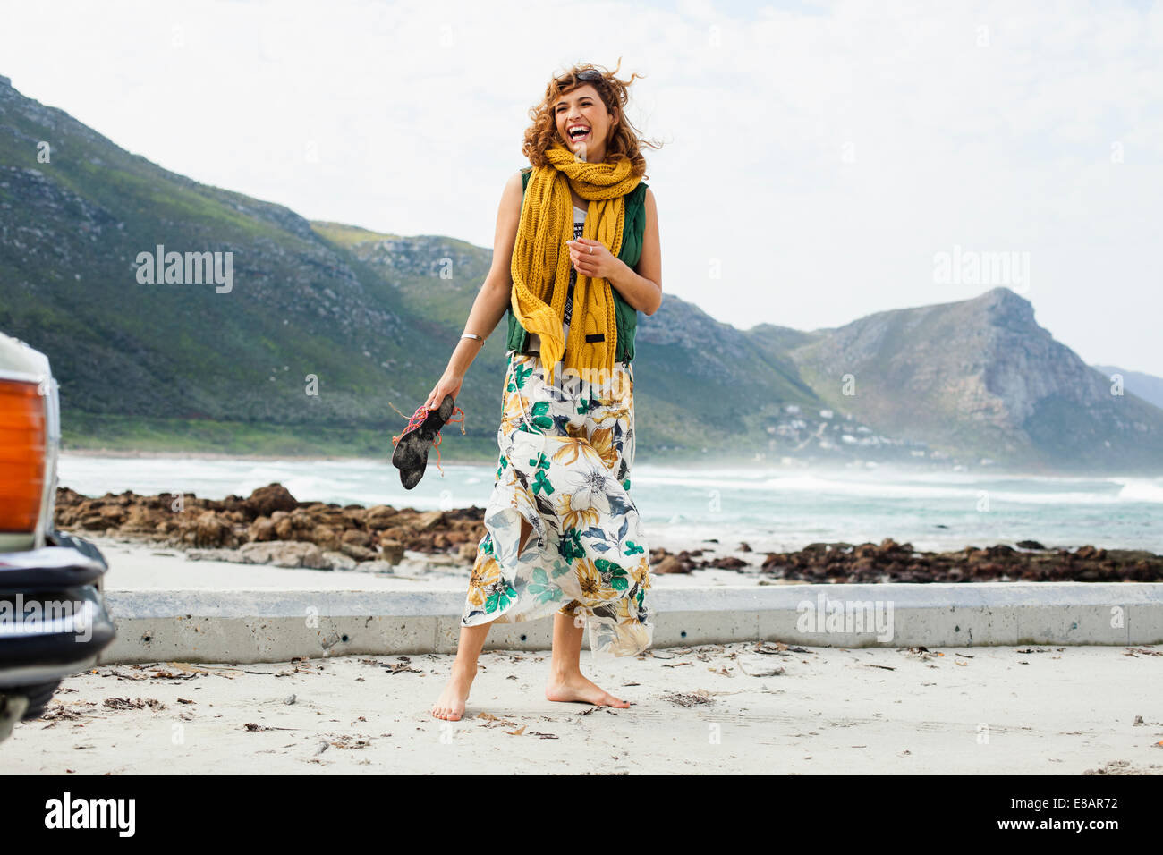 Young woman laughing on beach, Cape Town, Western Cape, South Africa Stock Photo