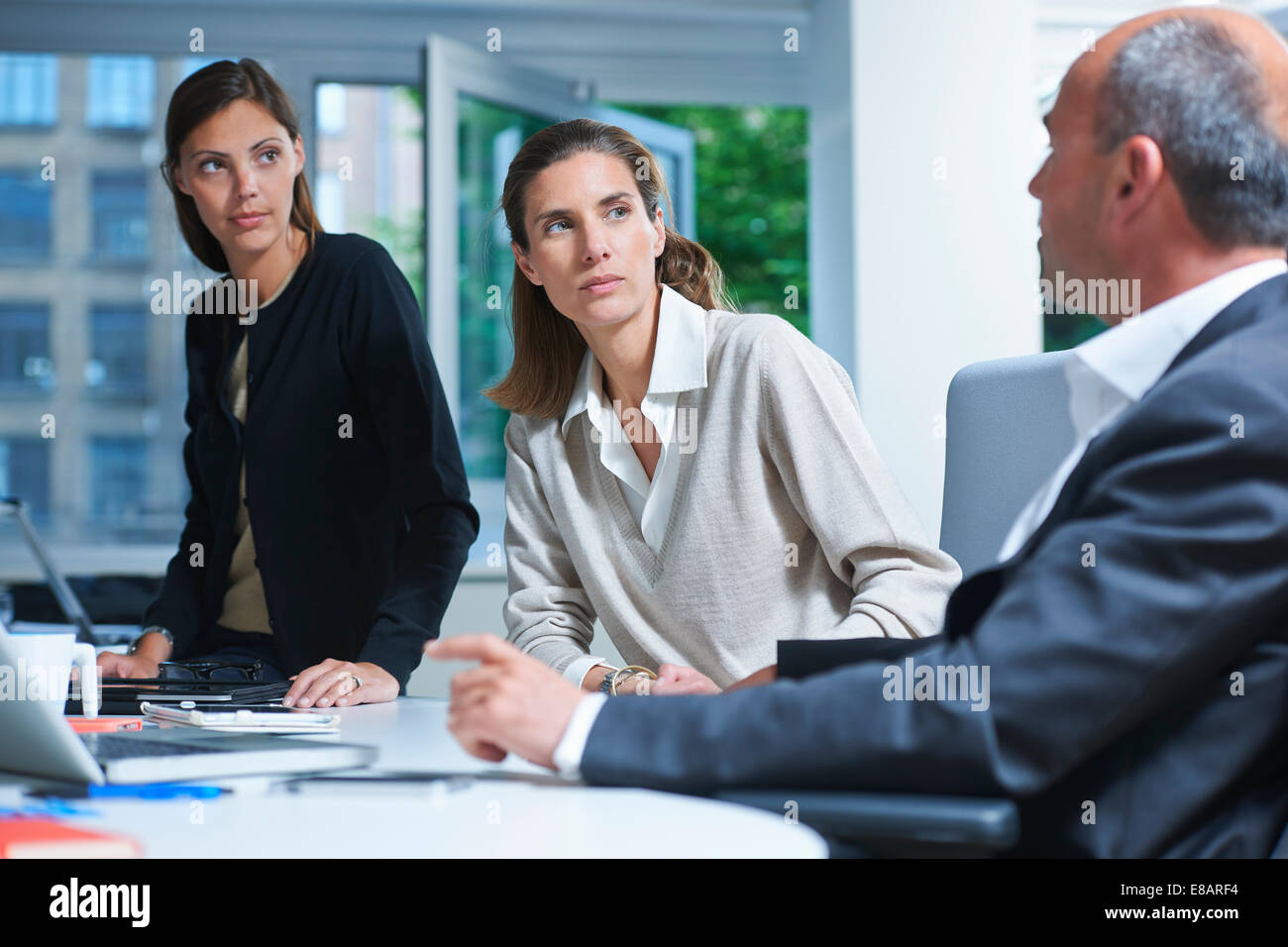 Three business colleagues meeting in office Stock Photo