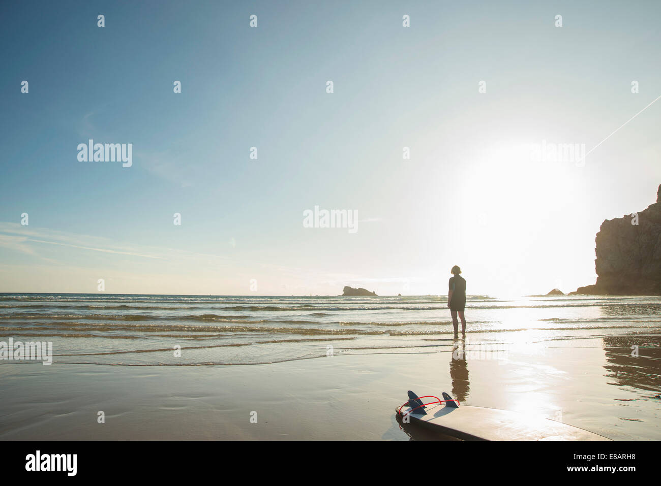 Woman standing in front of sea hi-res stock photography and images - Alamy