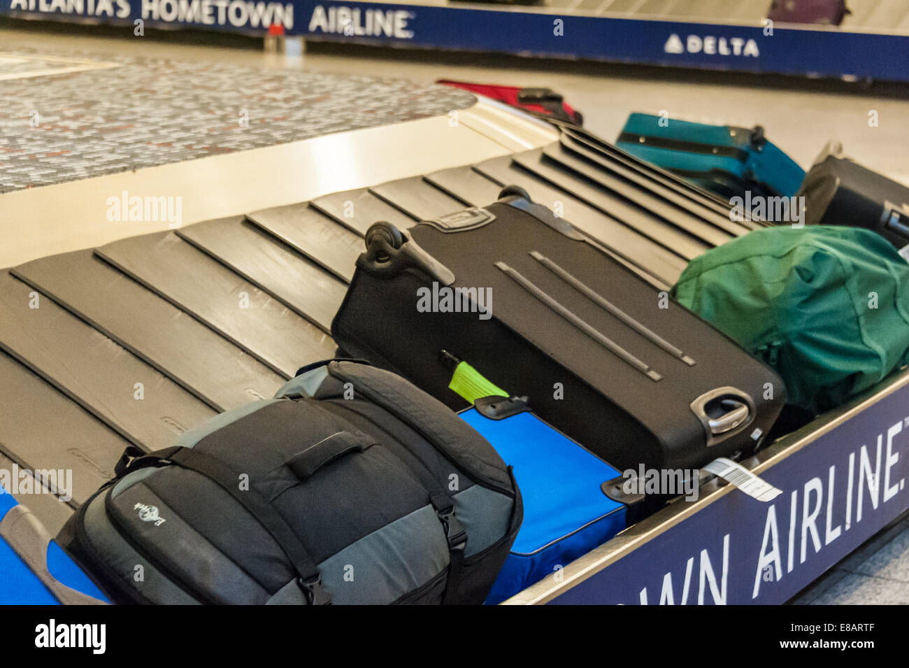 Baggage claim carousel with luggage at Hartsfield-Jackson Atlanta International Airport in Atlanta, Georgia, USA. Stock Photo