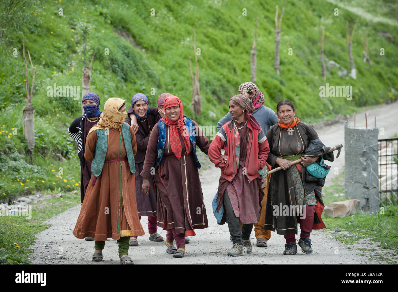 Women are walking on village street in mountains Stock Photo - Alamy