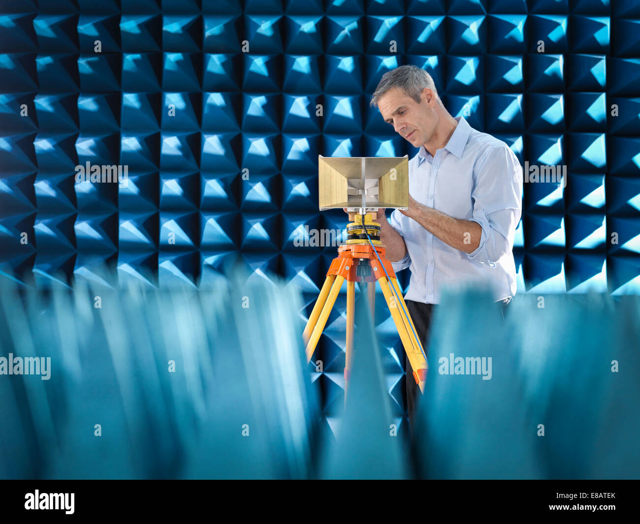 Scientist preparing to measure electromagnetic waves in anechoic chamber Stock Photo