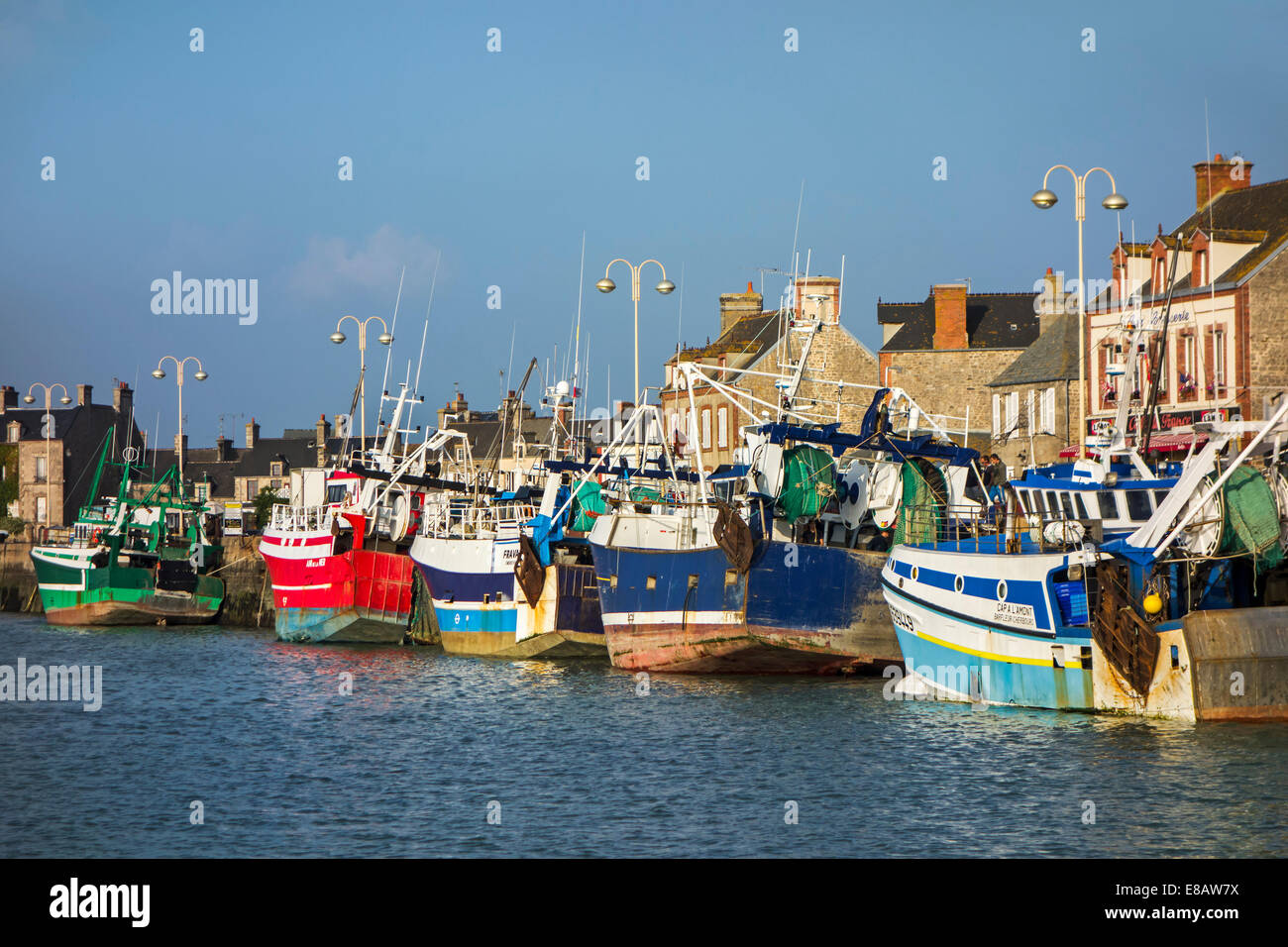 Colourful fishing trawlers / draggers docked in the Barfleur harbour, Lower Normandy, France Stock Photo