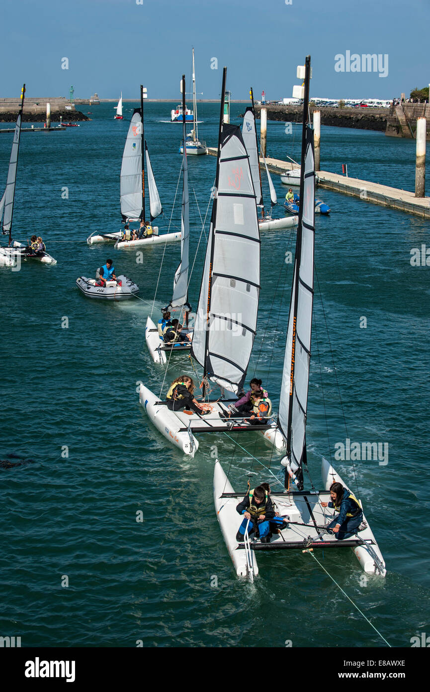 School children on catamarans leaving the Cherbourg port during sailing
