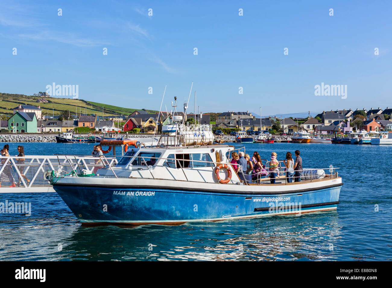 Tourist disembarking from a Dingle Dolphin sightseeing trip, Dingle, Dingle Peninsula, County Kerry, Republic of Ireland Stock Photo