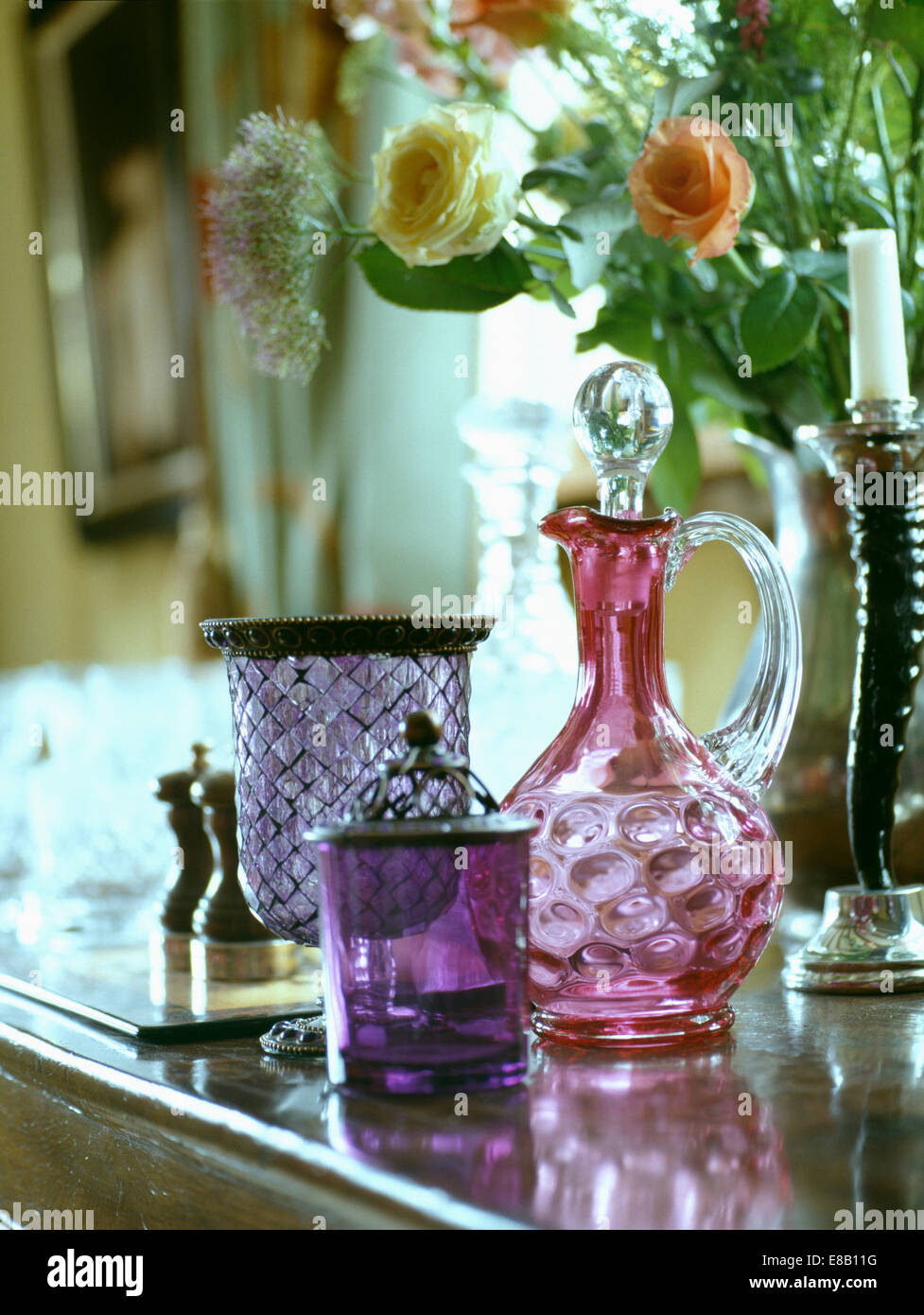 Still Life Of Antique Cranberry Glass Decanter With Purple And