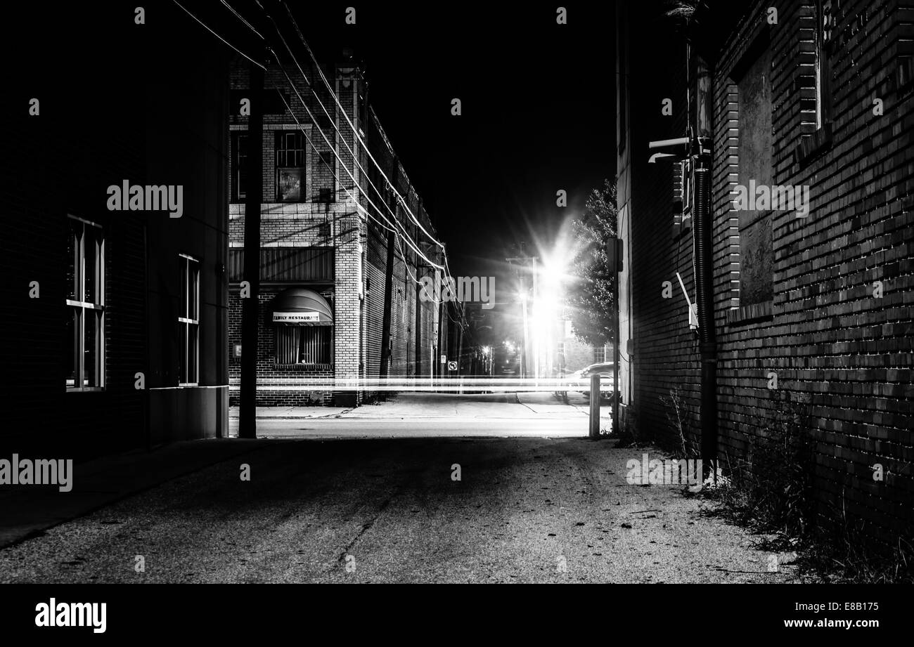 Dark alley and light trails in Hanover, Pennsylvania at night. Stock Photo