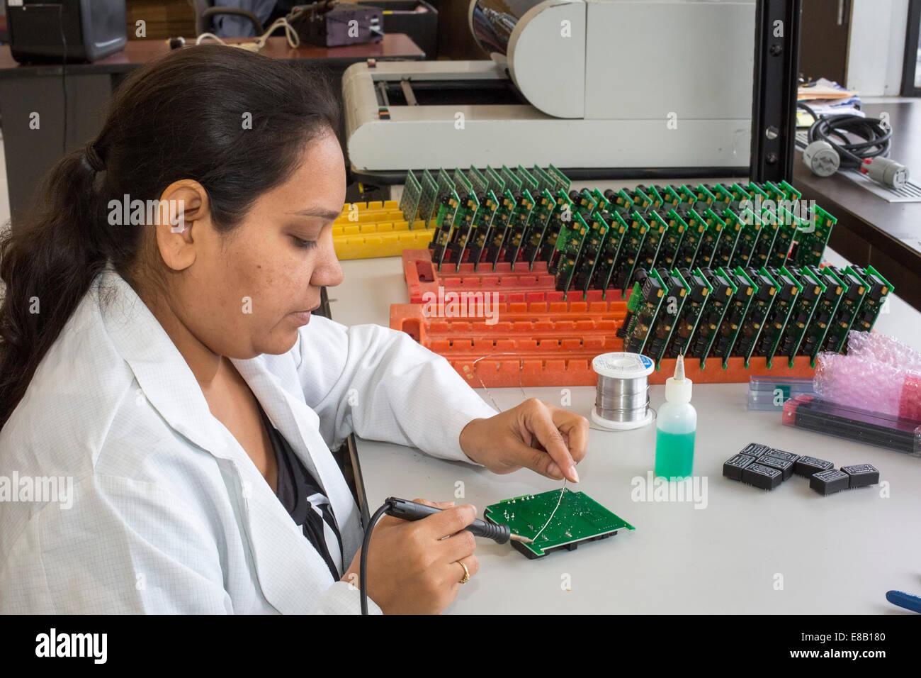 Detroit, Michigan - A worker for A123 Systems assembles circuit board for unmanned aerial vehicles (drones). Stock Photo