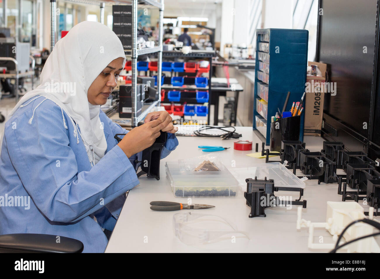 Detroit, Michigan - A worker for A123 Systems assembles parts for unmanned aerial vehicles (drones). Stock Photo