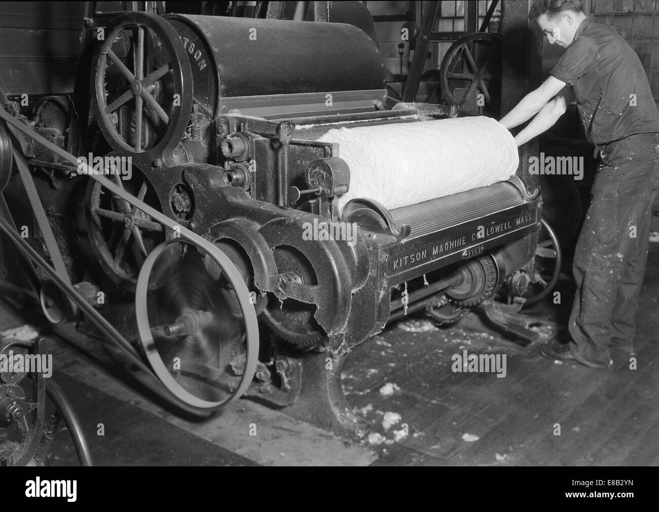 Man rolling fabric.  Textiles. Millville Manufacturing Co., New Jersey. 1936 Stock Photo