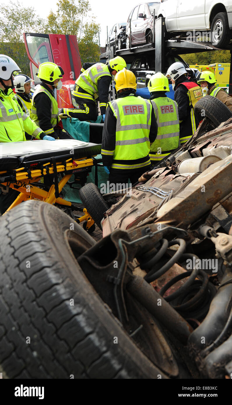 Fire service and ambulance crews at a car crash Stock Photo