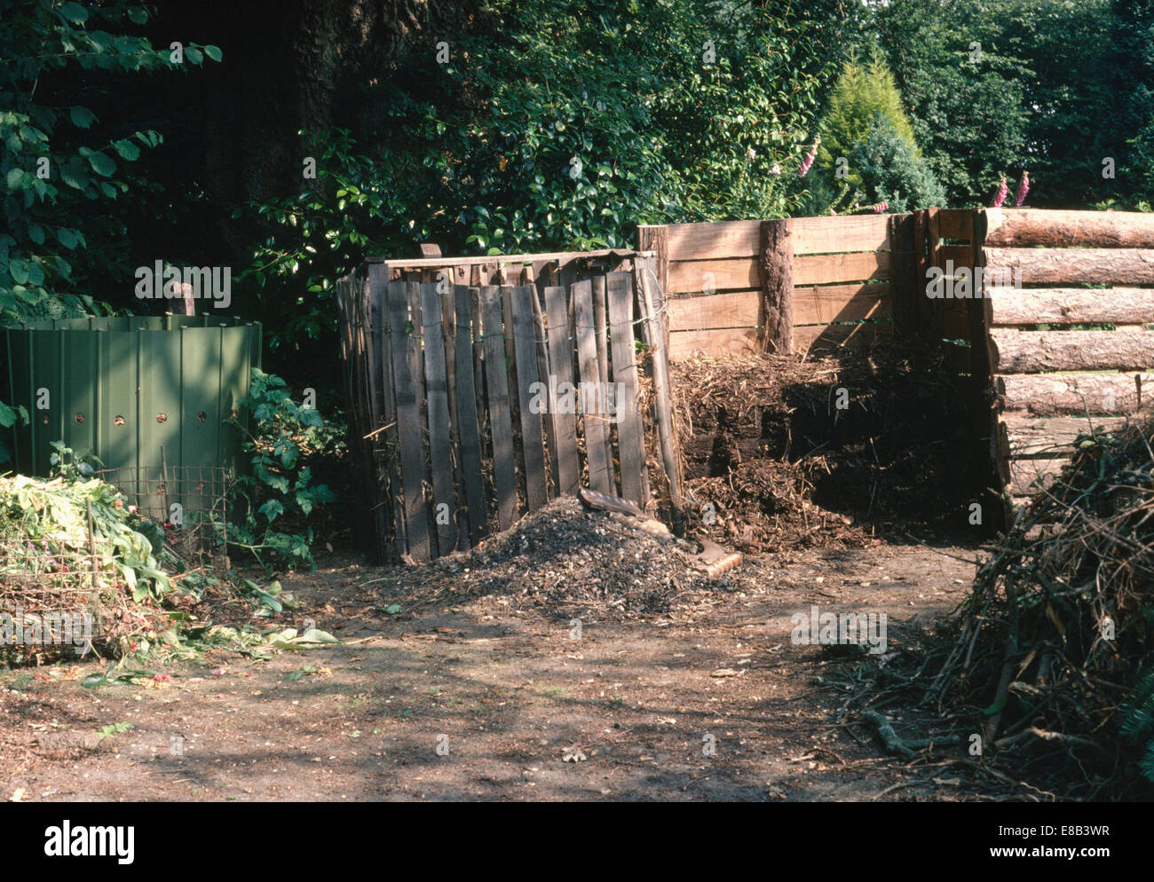 Compost heap and bin in country garden Stock Photo Alamy