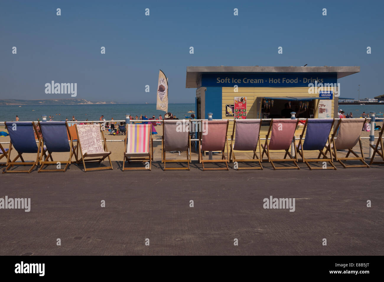 A row of deck chairs on the road by Weymouth beach, Dorset UK Stock Photo Alamy