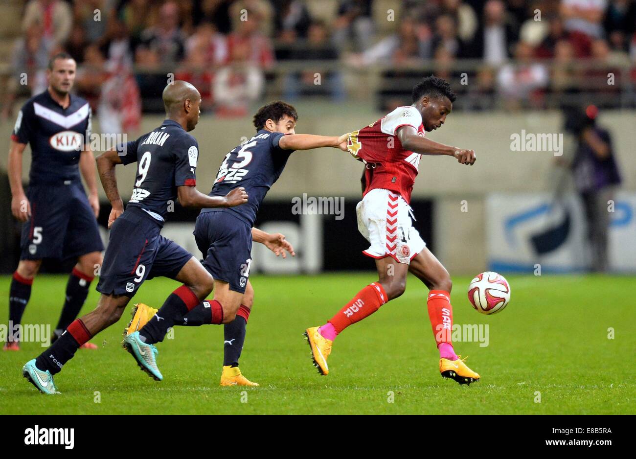 Rheims, France. 03rd Oct, 2014. French Division 1 League football. Reims versus Bordeaux. Benjamin Moukandjo (rei) and Younes Kaabouni (bor) © Action Plus Sports/Alamy Live News Stock Photo
