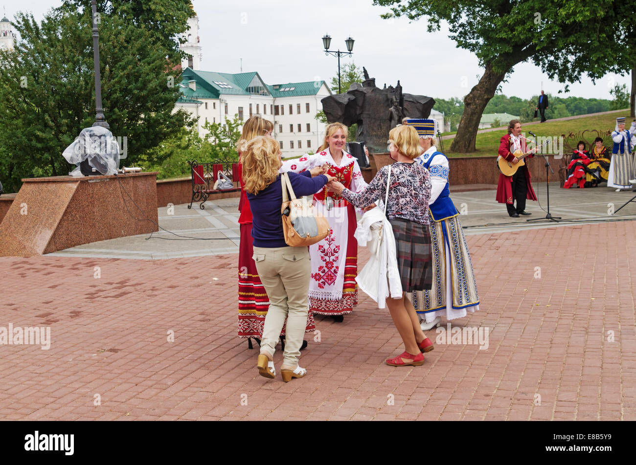 The Belarus folklore groups sings on streets in Vitebsk. Viewers dances