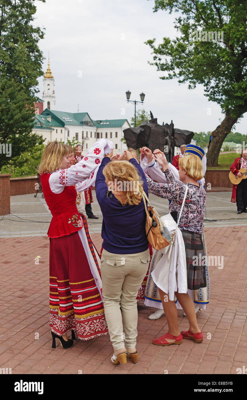 The Belarus folklore groups sings on streets in Vitebsk. Viewers dances