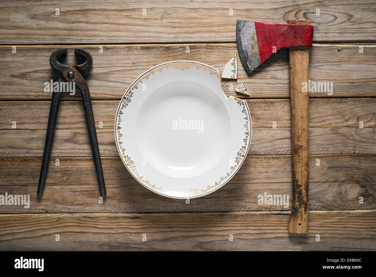 Ax and tongs as tableware Stock Photo