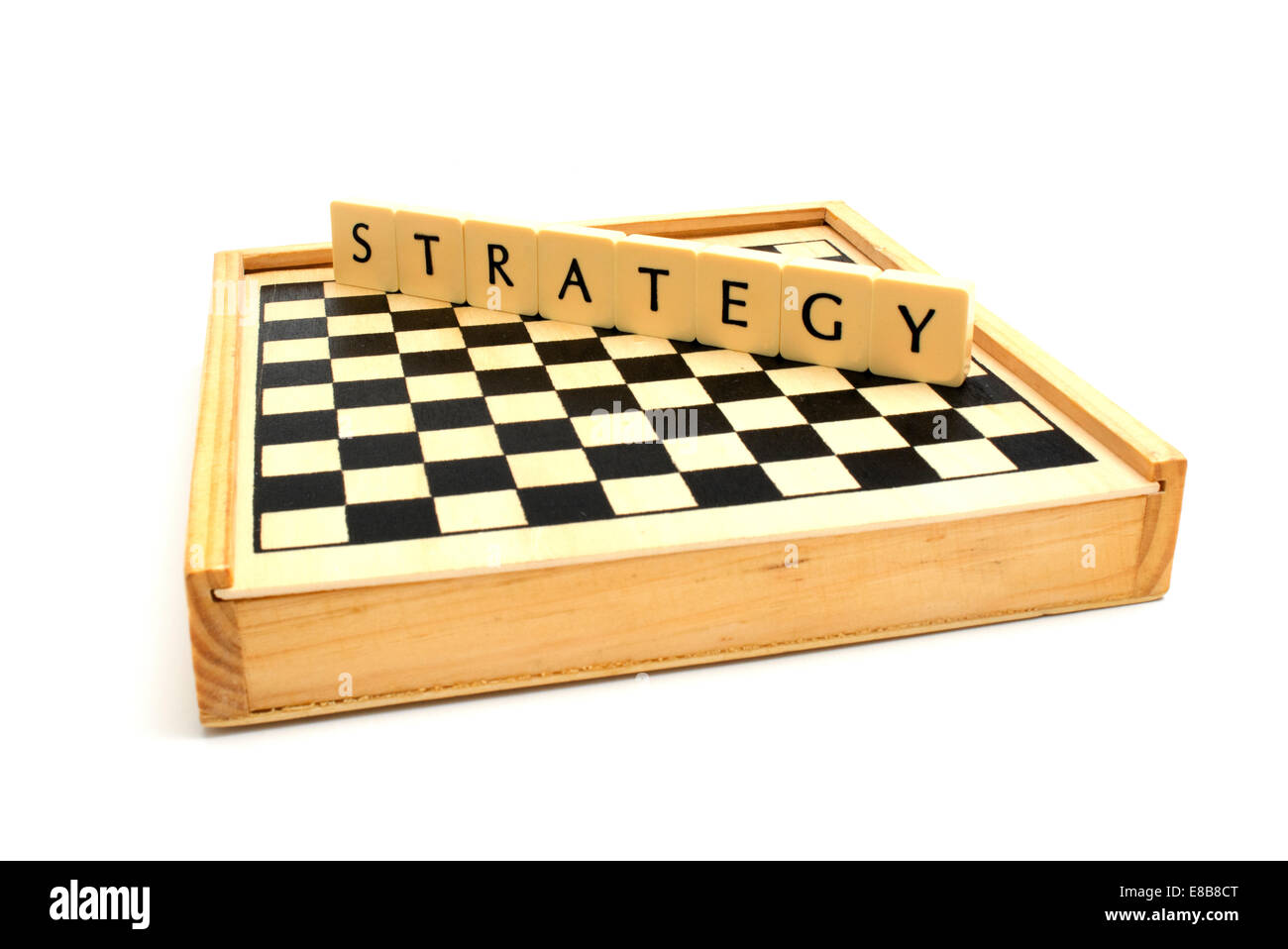 Chess board and strategy word together. Stock Photo