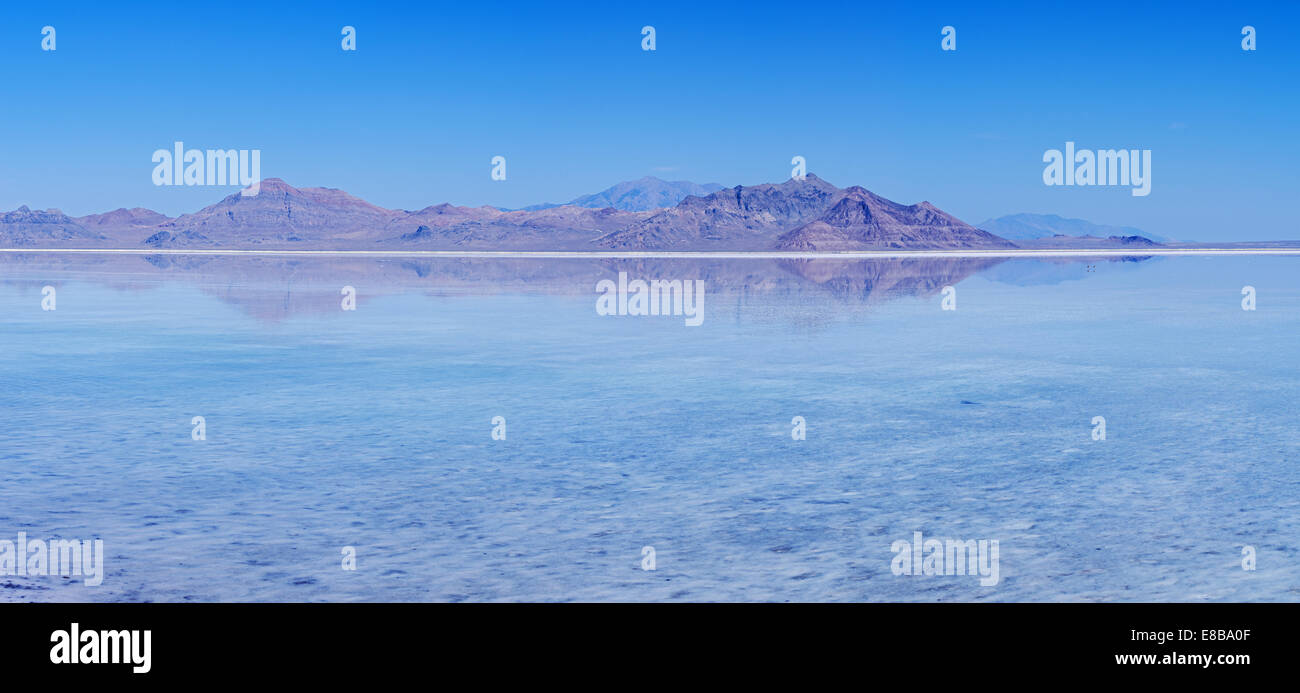 flooded Bonneville Salt Flats with reflection of distant peaks and blue sky Stock Photo