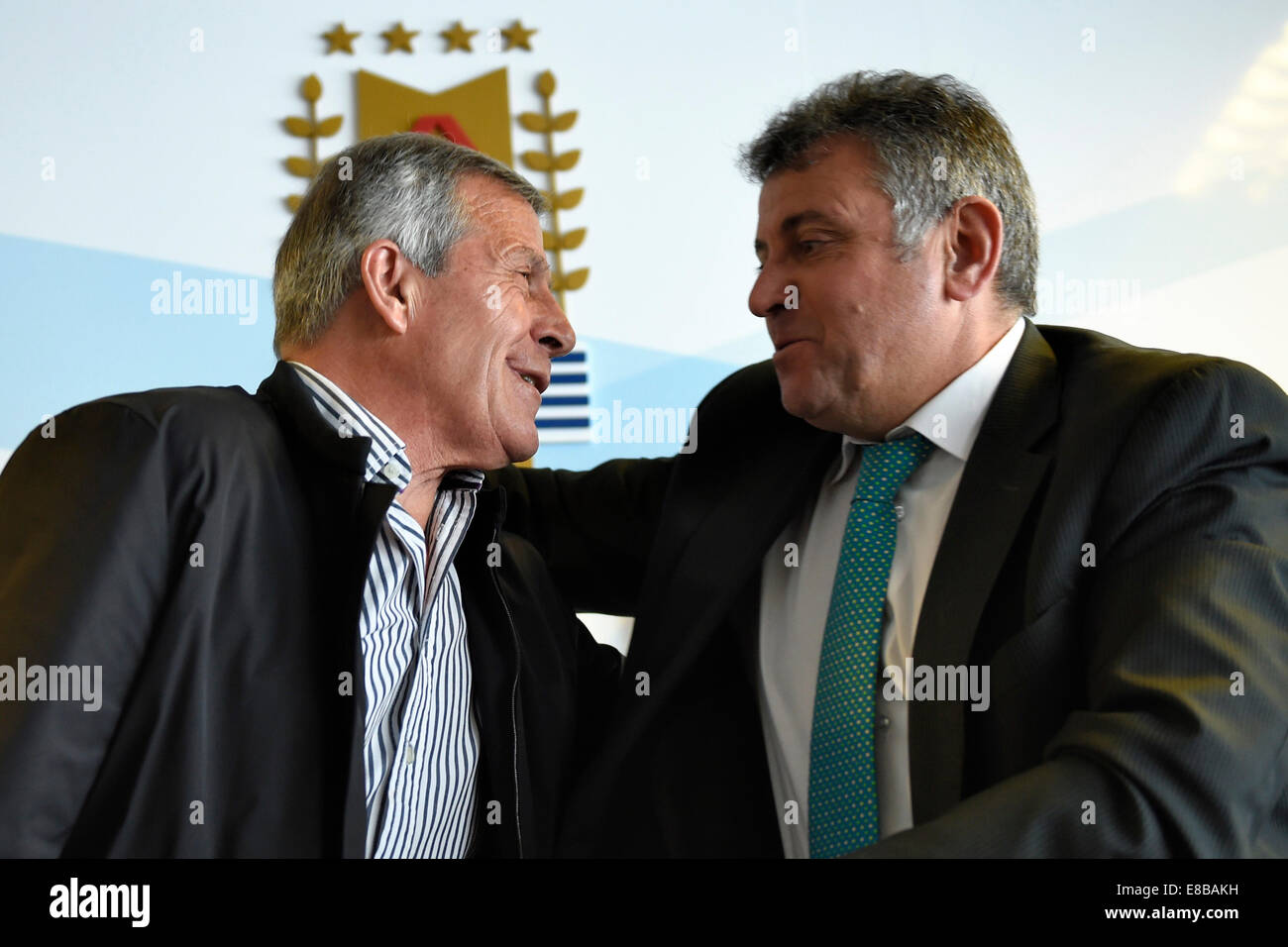 Montevideo, Uruguay. 3rd Oct, 2014. Uruguay's national soccer team head coach Oscar Washington Tabarez (L) and President of Uruguayan Football Association (AFU, for its acronym in Spanish) Wilmar Valdez attend a press conference held at the headquarters of AFU in Montevideo, capital of Uruguay, on Oct. 3, 2014. Tabarez renewed his contract with the AFU to lead the Uruguayan national soccer team until 2018 World Cup Russia. © Nicolas Celaya/Xinhua/Alamy Live News Stock Photo