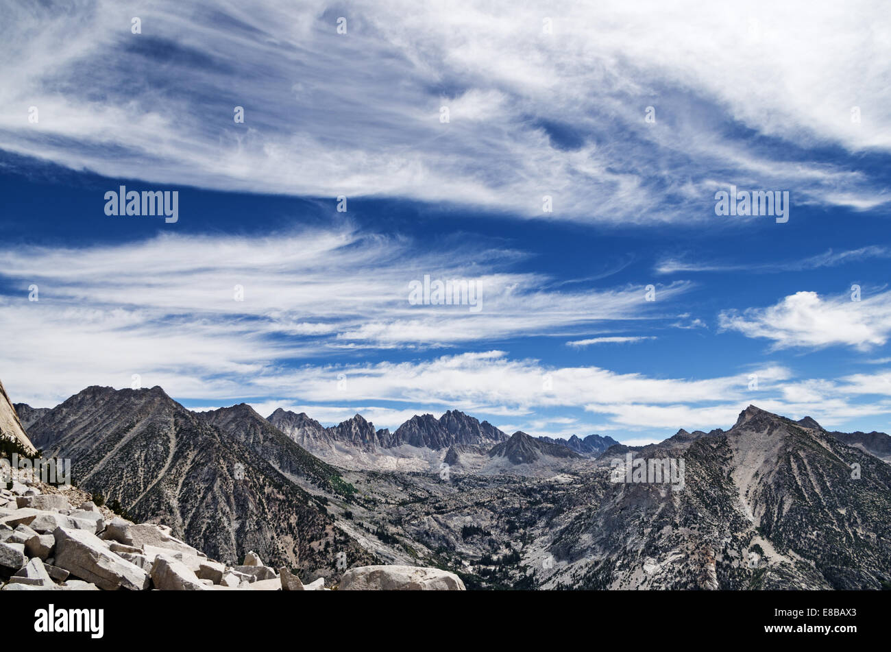 Sierra Nevada Mountain landscape looking over LeConte Canyon to Dusy Basin and the Palisades with feathery clouds Stock Photo