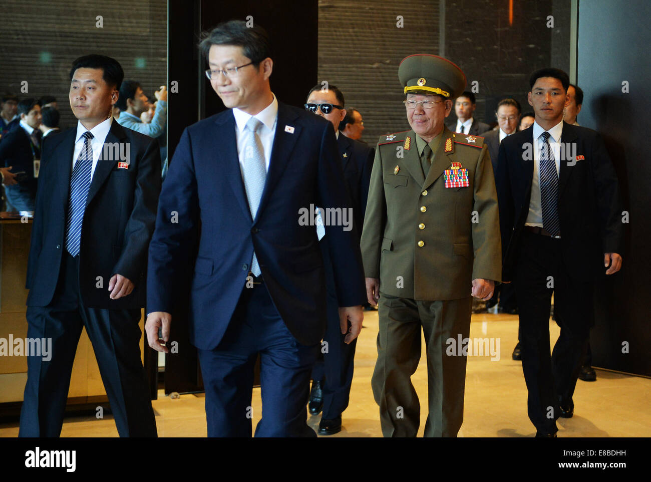 Incheon, South Korea. 4th Oct, 2014. Hwang Pyong So (2nd R, front), leader of the Democratic People's Republic of Korea (DPRK), leaves the hotel to meet DPRK athletes in Incheon, South Korea, Oct. 4, 2014. Credit:  Lu Zhe/Xinhua/Alamy Live News Stock Photo