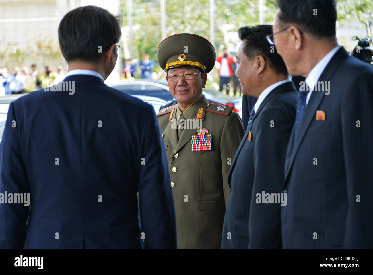 Incheon, South Korea. 4th Oct, 2014. Hwang Pyong So (2nd L), leader of the Democratic People's Republic of Korea (DPRK), leaves the hotel to meet DPRK athletes in Incheon, South Korea, Oct. 4, 2014. Credit:  Lu Zhe/Xinhua/Alamy Live News Stock Photo