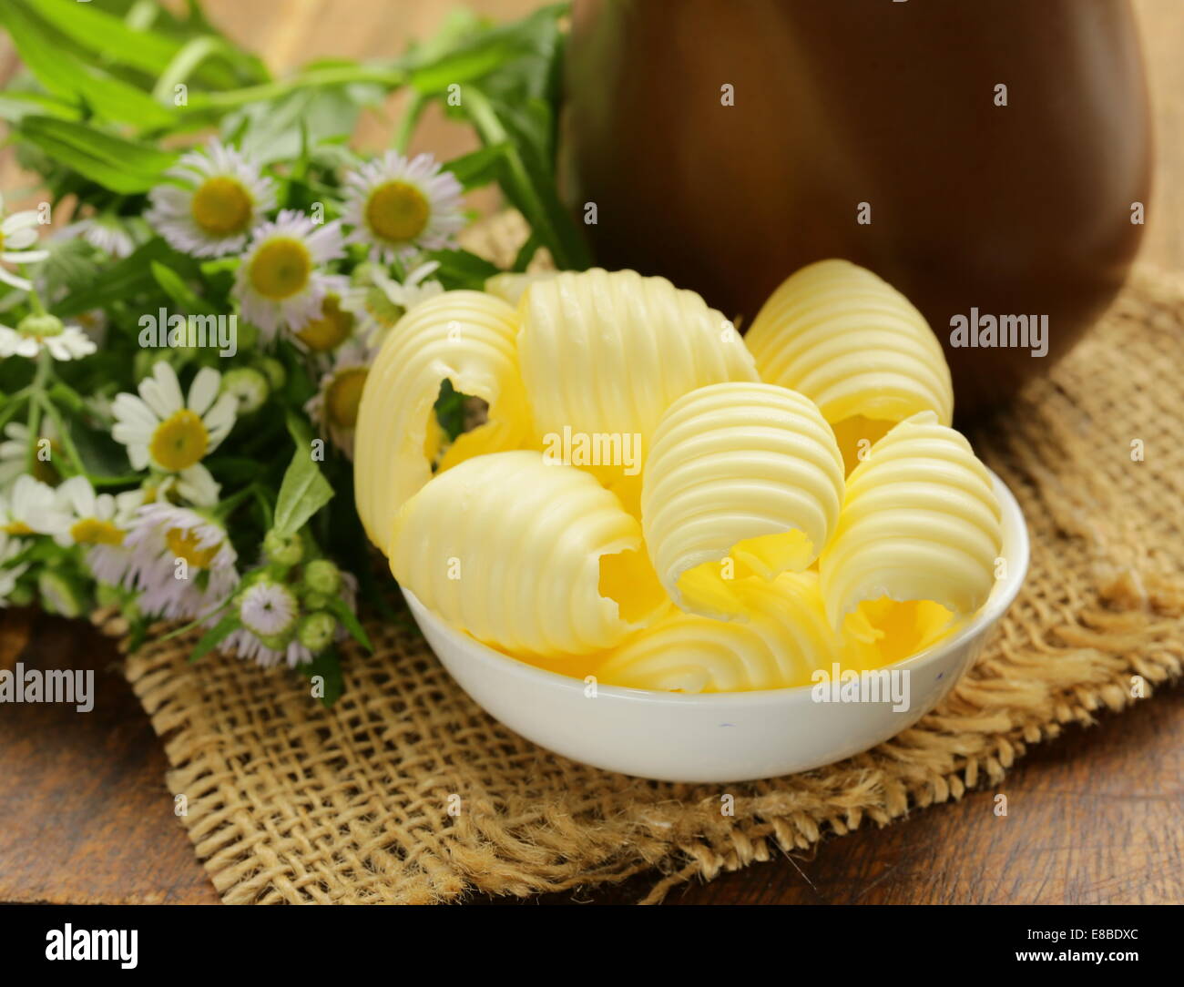 fresh yellow dairy butter in a white bowl Stock Photo Alamy