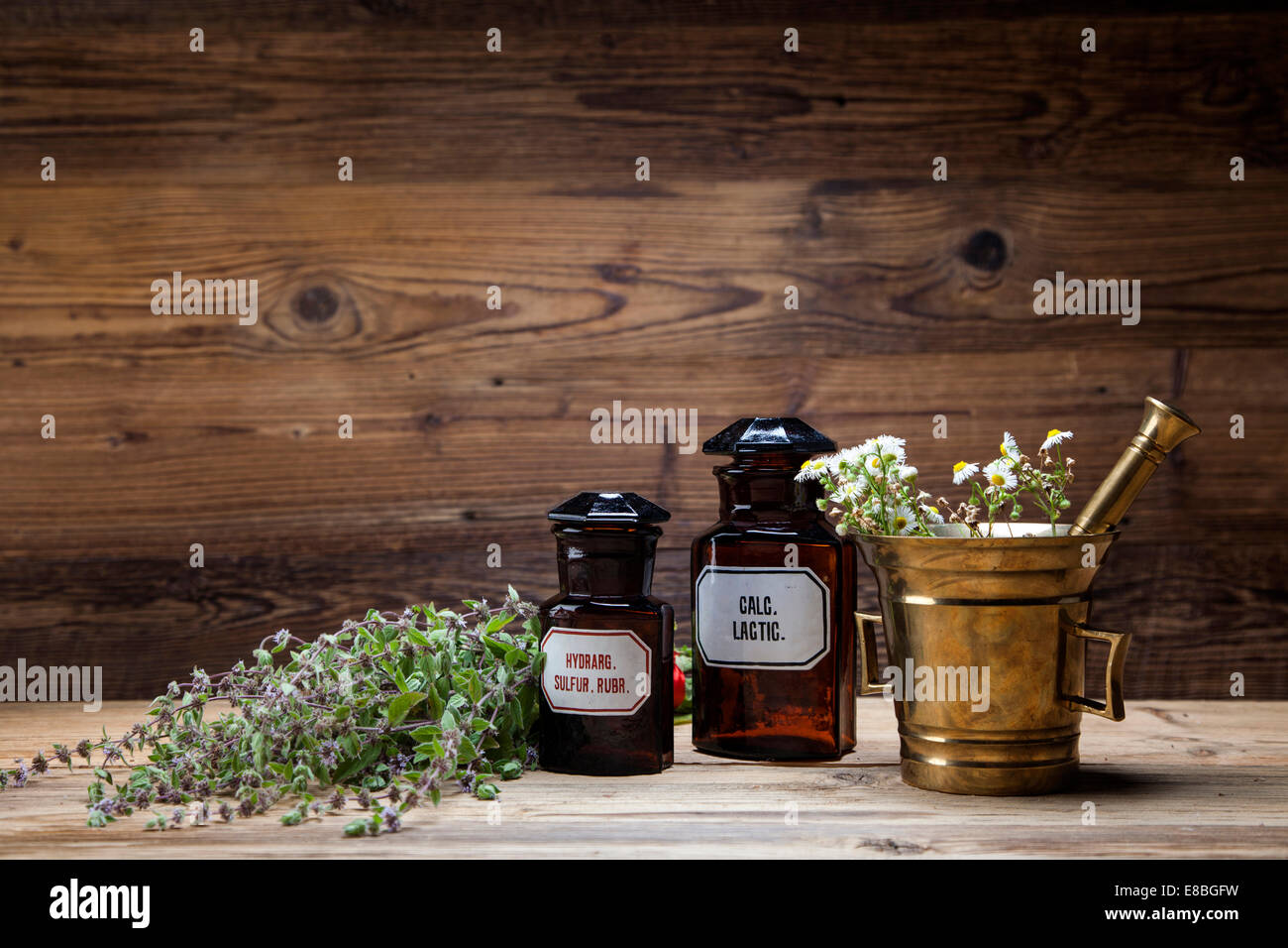 The ancient natural medicine, herbs, medicines and old book Stock Photo