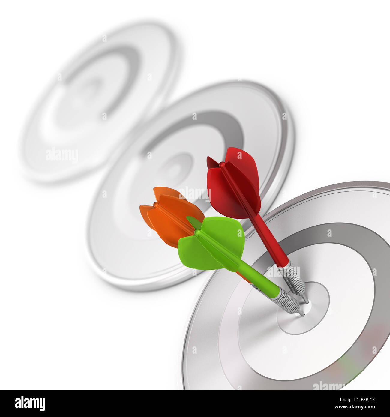 Three darts hitting the center of a modern dartboard, target concept to
