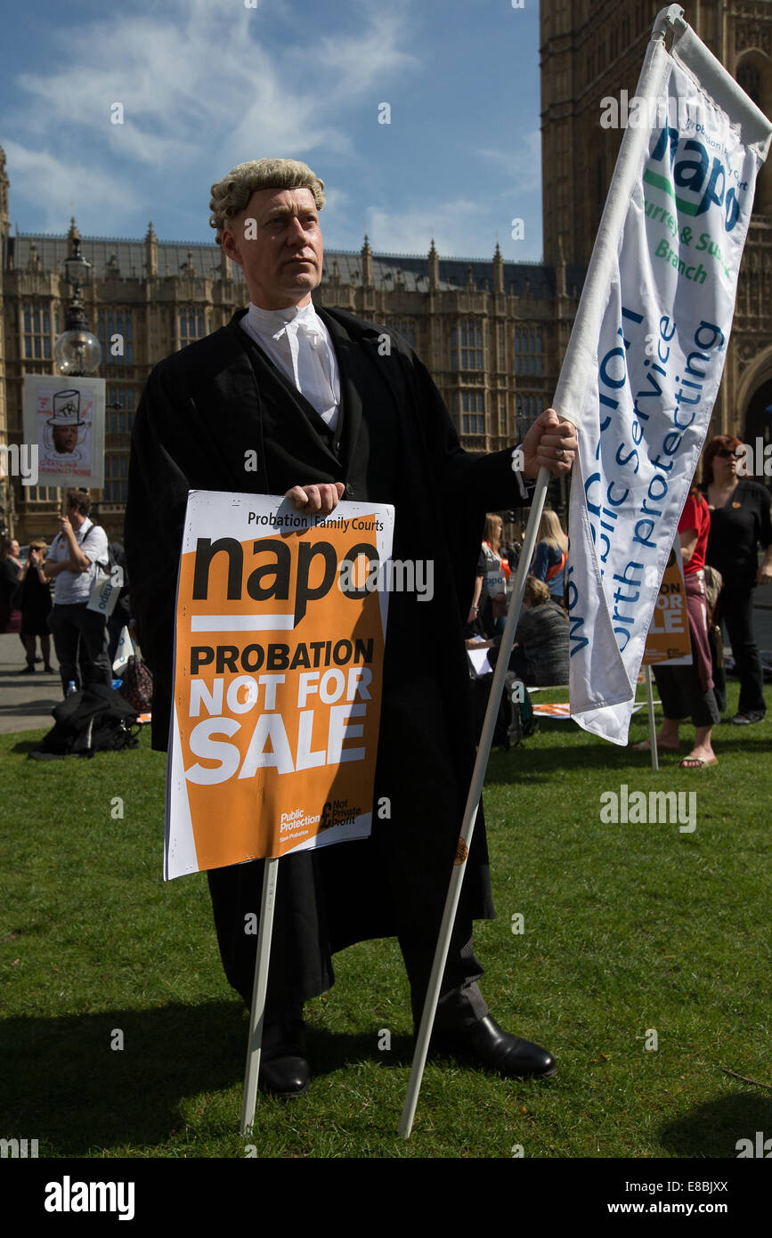Lawyers and Probation Officers demonstrate outside Parliament against the Ministry of Justice's new 'Fee and Contract' arrangements. Meaning, people accused of a crime who can't afford a lawyer will not get justice.  Featuring: Barrister protesting Where: London, United Kingdom When: 01 Apr 2014 Stock Photo