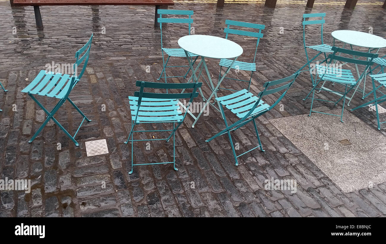 London, UK 4th October 2014.  Empty seats arranged outside the Market Building courtyard in Covent Garden on a rainy morning in London. Photo by David Mbiyu/ Alamy Live News Stock Photo