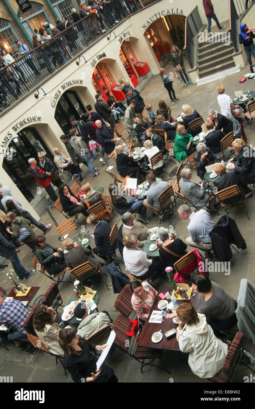 London, UK 4th October 2014.  People seen having englidh tea in the Market Building courtyard  Photo by David Mbiyu/ Alamy Live News Stock Photo