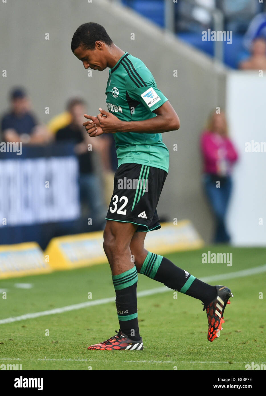Sinsheim, Germany. 4th Oct, 2014. Schalke's Joel Matip leaves after a red card at the German Bundesliga match between 1899 Hoffenheim and FC Schalke at the Rein Neckar Arena in Sinsheim, Germany, 4 October 2014. Photo: UWE ANSPACH/dpa (ATTENTION: Due to the accreditation guidelines, the DFL only permits the publication and utilisation of up to 15 pictures per match on the internet and in online media during the match.)/dpa/Alamy Live News Stock Photo