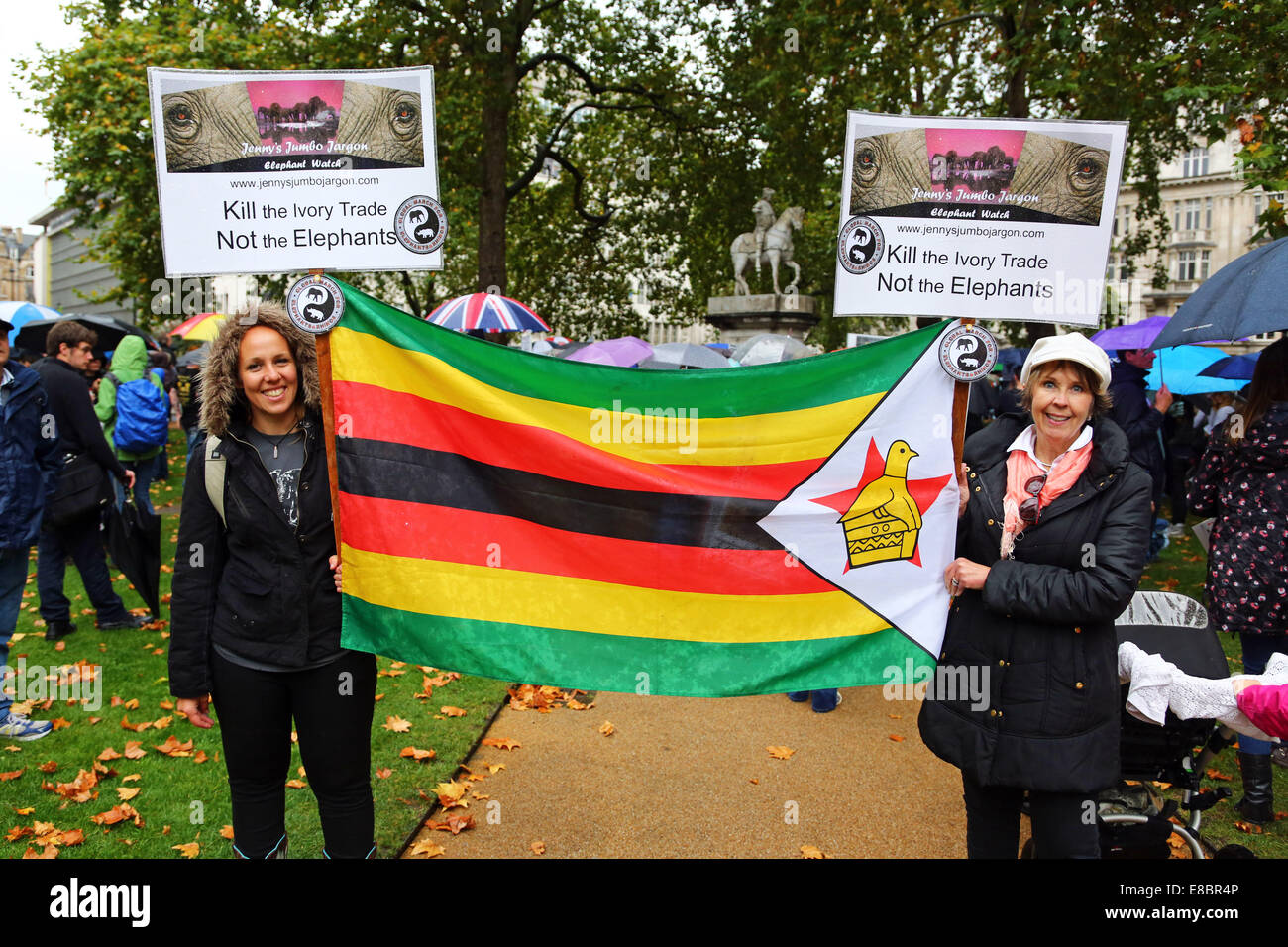 London, UK. 4th October 2014. Marchers at the Global March for Elephants and Rhinos, London, England. Rain didn't dampen the spirits of the marchers raising awareness of the plight of elephants and rhinos which amongst other things are being killed by poachers for ivory and souvenirs. Credit:  Paul Brown/Alamy Live News Stock Photo