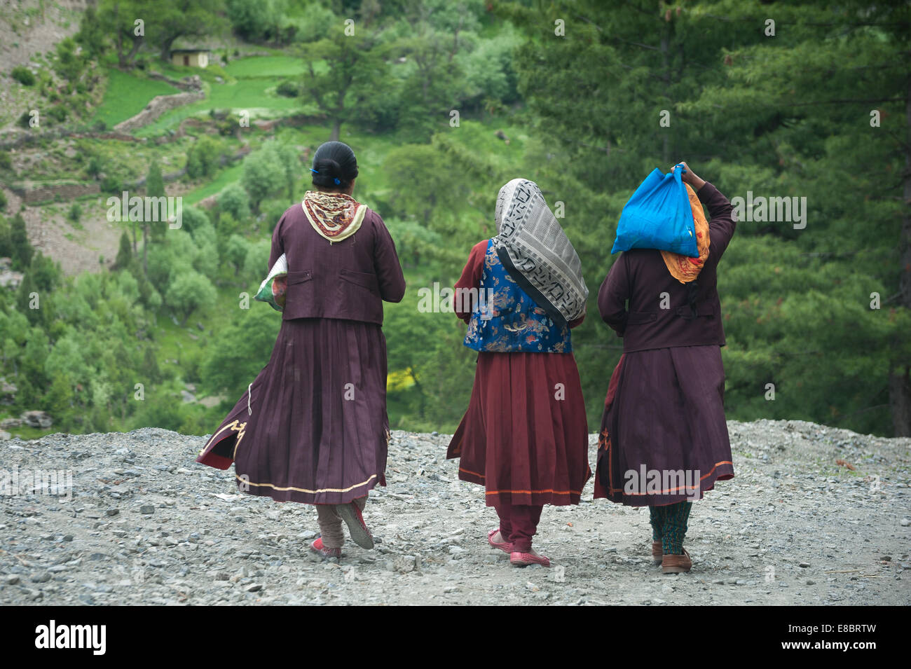 Women are walking on village street in mountains Stock Photo - Alamy