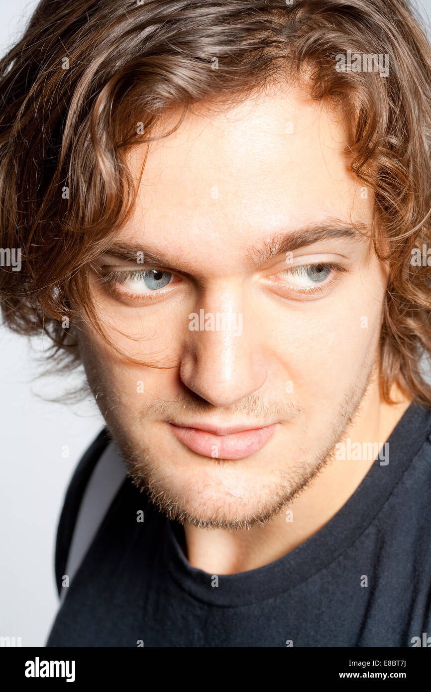Closeup Portrait of a Young Man with Brown Hair. Stock Photo