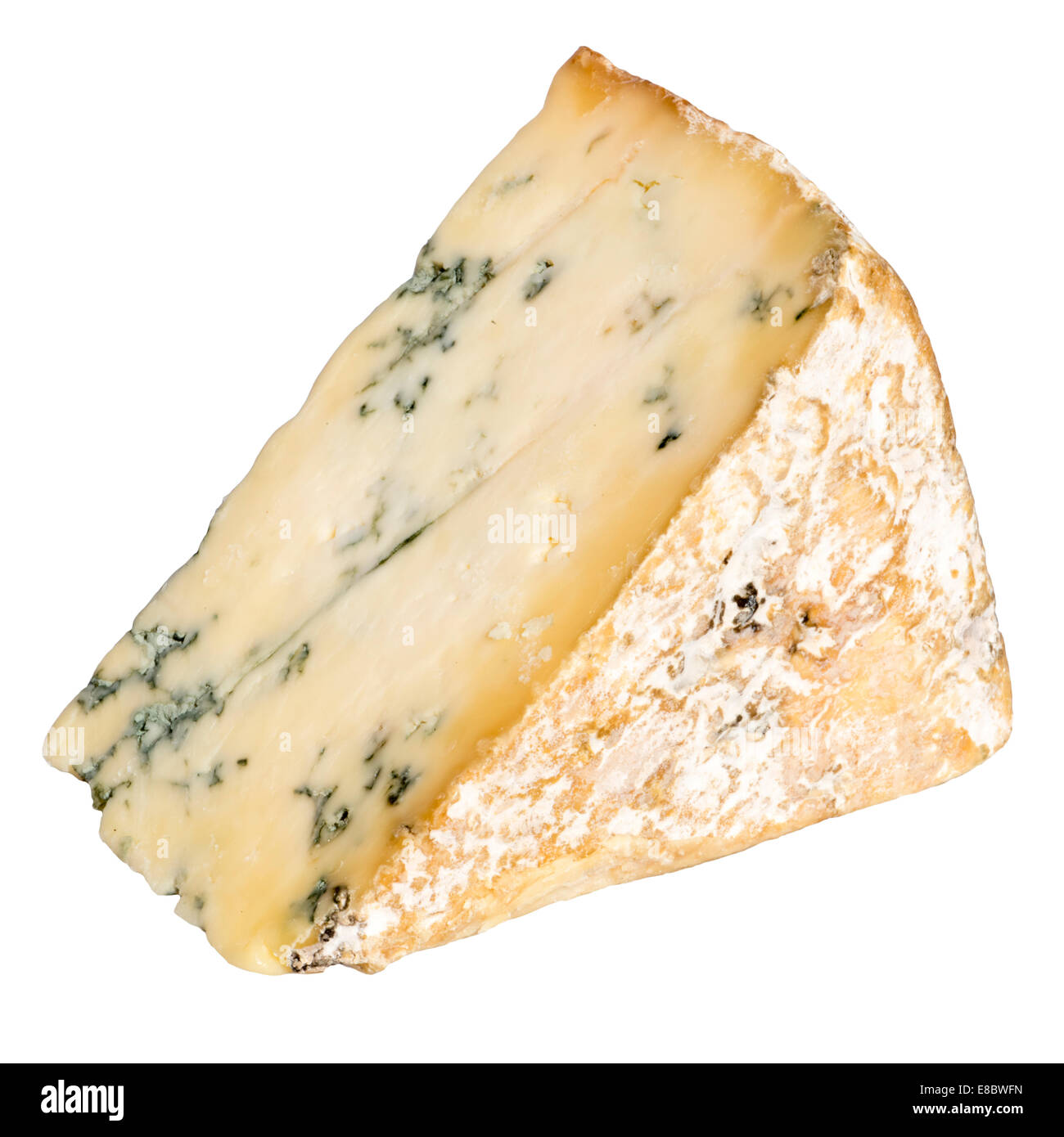 Wedge of blue Stilton cheese cut out or isolated against a white