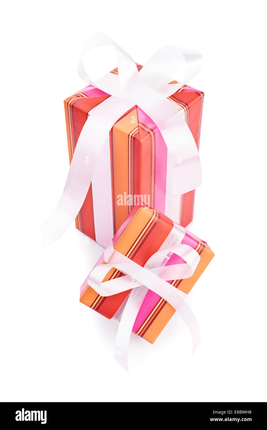 Two gifts wrapped in colorful wrapping paper with white ribbons ...