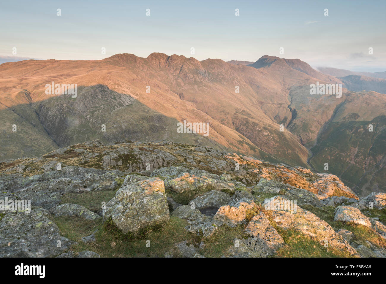 Crinkle Crags and Bowfell from Pike Of Blisco at dawn in summer, English Lake District national park Stock Photo