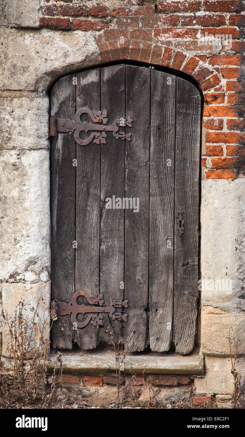 Pump house ancient wooden door, Little Walsingham, Norfolk, UK. Stock Photo