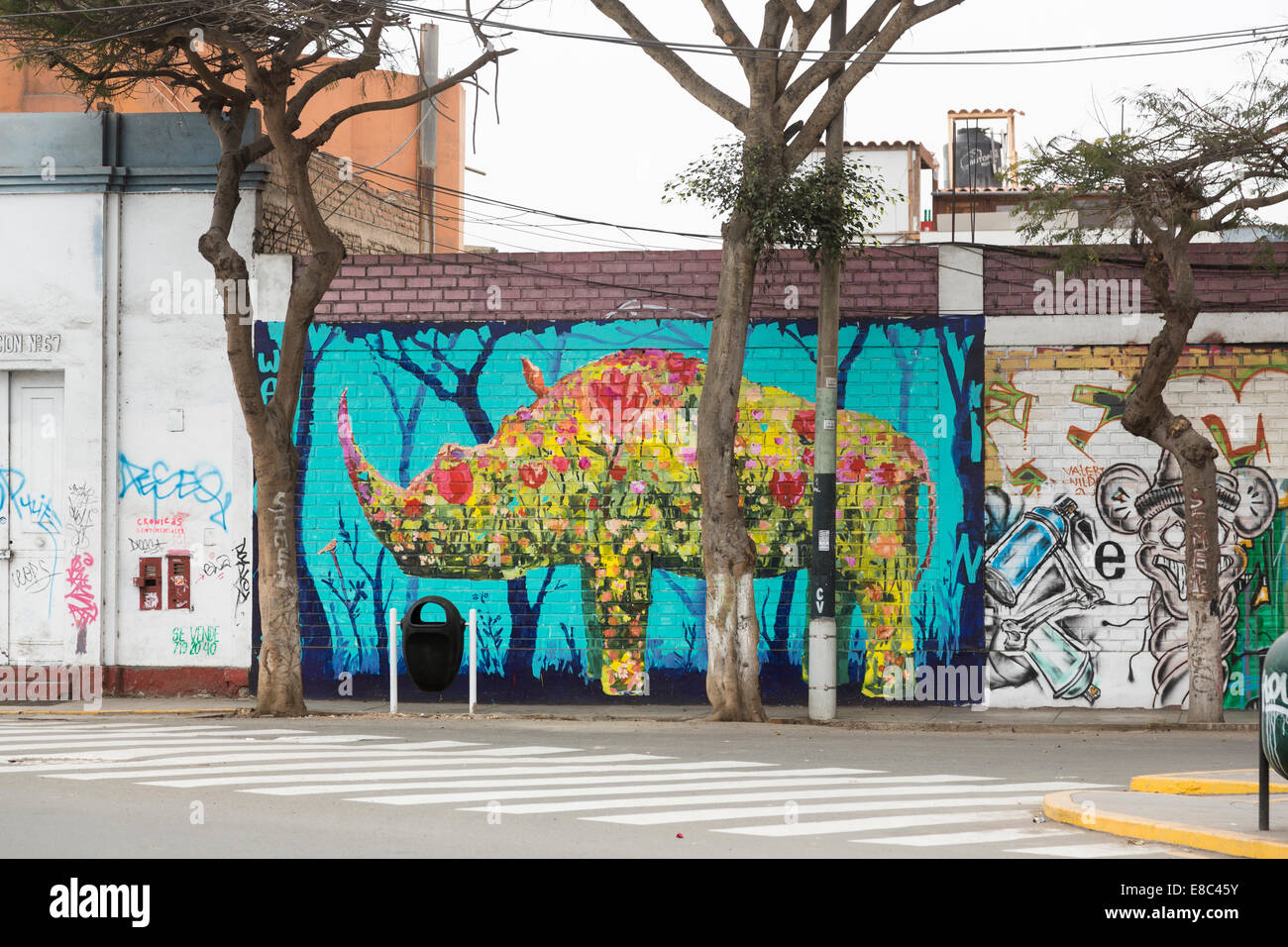 Urban art: Colourful graffiti wall painting of a rhinoceros in a street in Barranco, a suburb of Lima, Peru Stock Photo