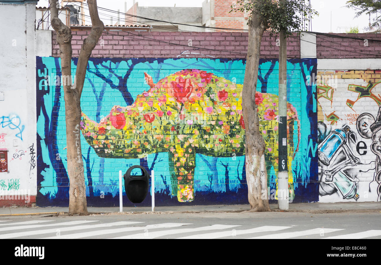 Urban art: Colourful graffiti wall painting of a rhinoceros in a street in Barranco, a suburb of Lima, Peru Stock Photo