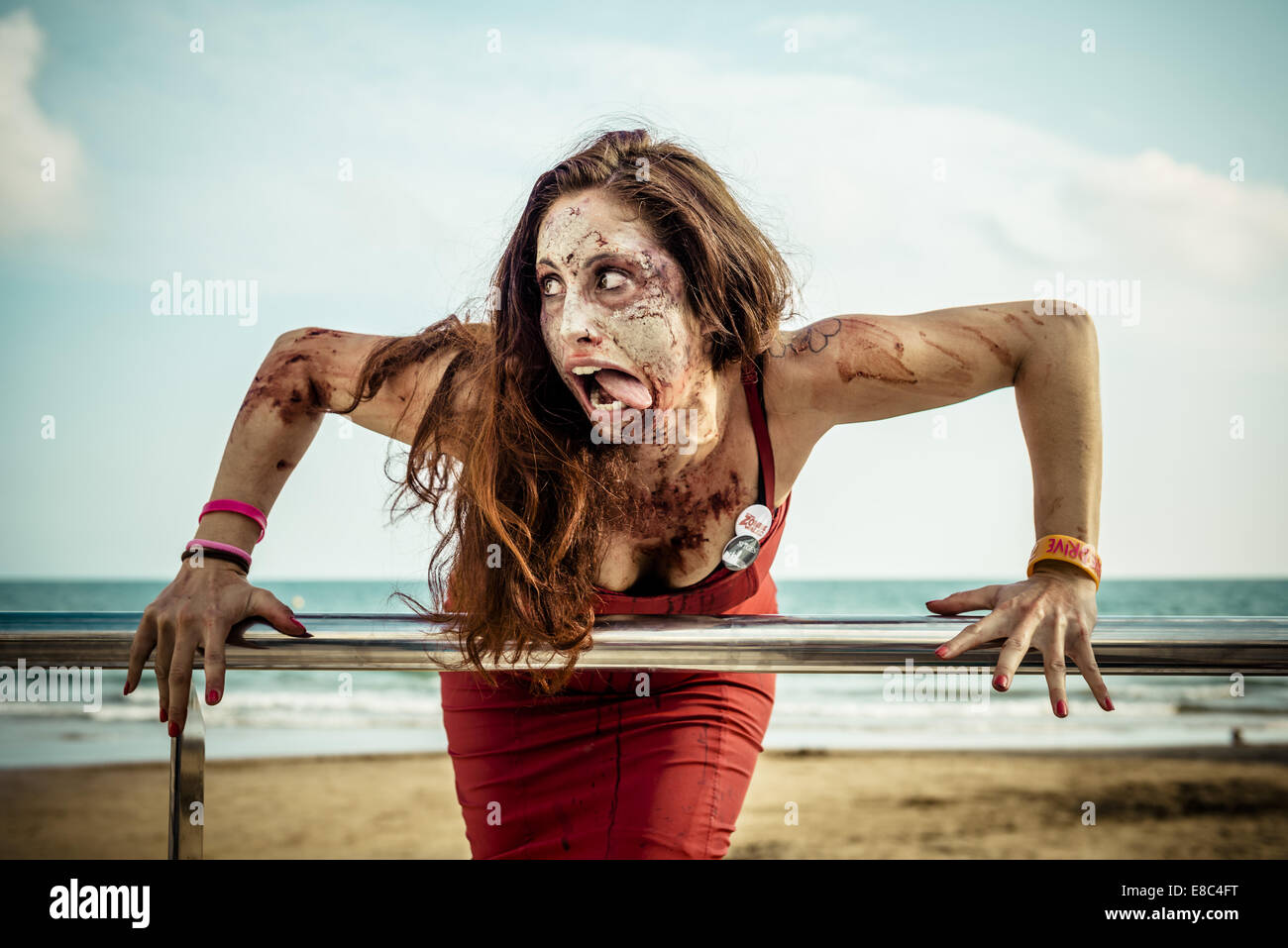 Sitges, Spain. 4th Oct, 2014. A woman with a zombie makeup has found her role in front of the camera at the Sitges Zombie Walk 2014 Credit:  Matthias Oesterle/ZUMA Wire/ZUMAPRESS.com/Alamy Live News Stock Photo