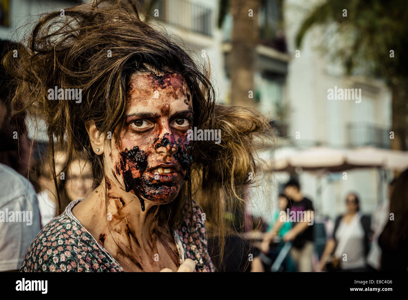 Sitges, Spain. 4th Oct, 2014. A woman shows off her zombie makeup as she takes part in the Sitges Zombie Walk 2014 Credit:  Matthias Oesterle/ZUMA Wire/ZUMAPRESS.com/Alamy Live News Stock Photo