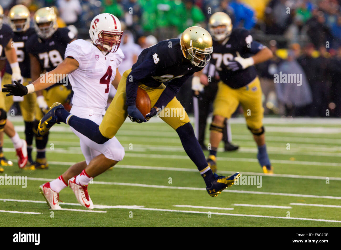 South Bend, Indiana, USA. 4th Oct, 2014. Notre Dame WR COREY ROBINSON (88) makes a juggling catch against Stanford ILB BLAKE MARTINEZ (4) during the fourth quarter. The Notre Dame Fighting Irish beat the Stanford Cardinal 17-14 at Notre Dame Stadium in South Bend, Indiana. Credit:  Frank Jansky/ZUMA Wire/Alamy Live News Stock Photo