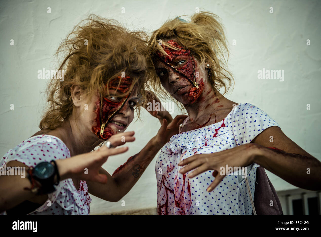 Sitges, Spain. 4th Oct, 2014. Two girls made-up as zombies take part in the Sitges Zombie Walk 2014 Credit:  Matthias Oesterle/ZUMA Wire/ZUMAPRESS.com/Alamy Live News Stock Photo